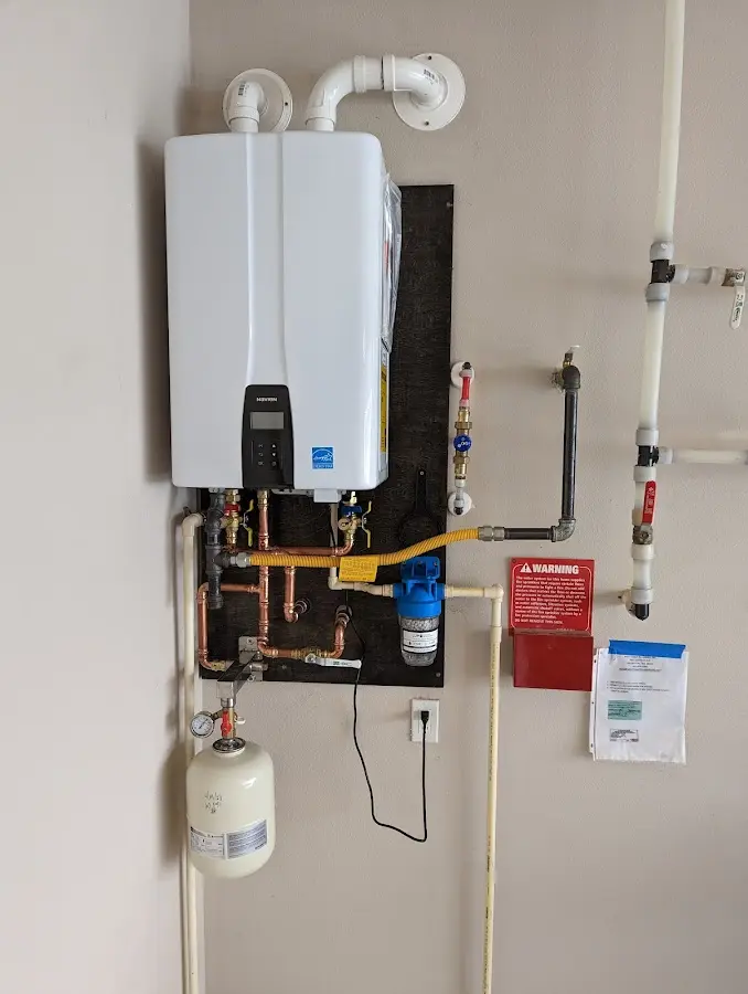 Professional plumber installing copper piping in a Wheatland home